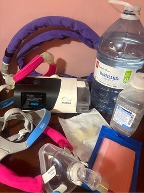 ResMed CPAP Setup with Purple and Pink Headgear